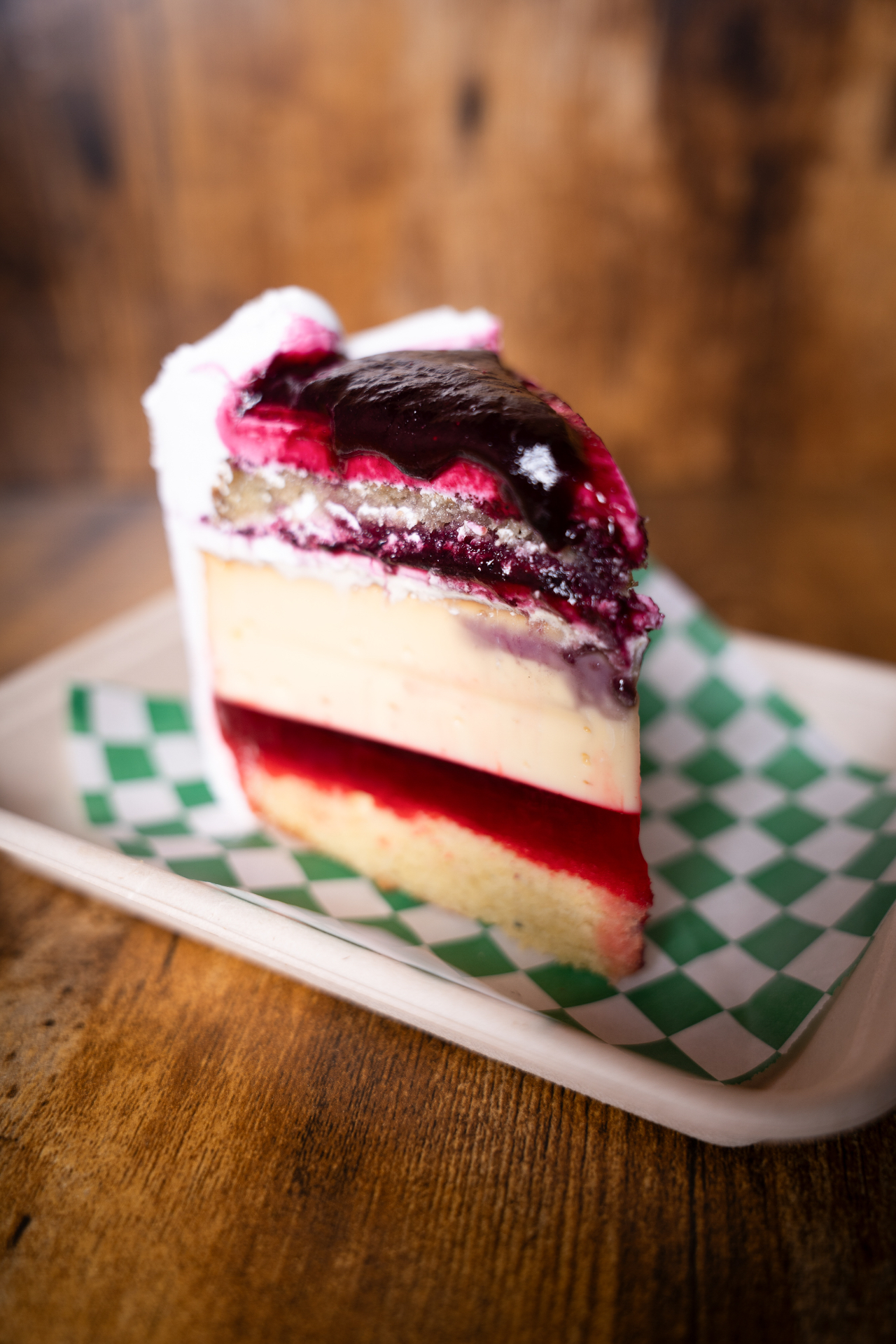Slice of layered berry cheesecake