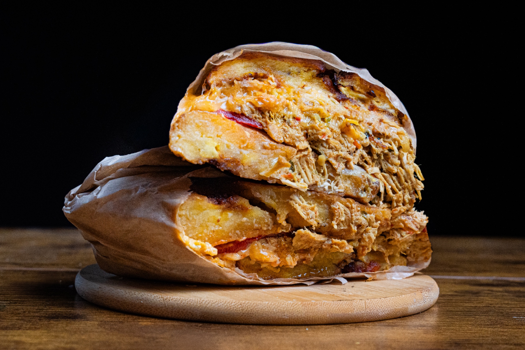 Overstuffed shredded chicken arepa